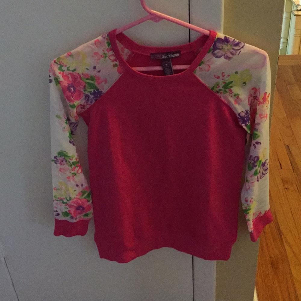 A hot pink, floral long sleeve tee shirt.
